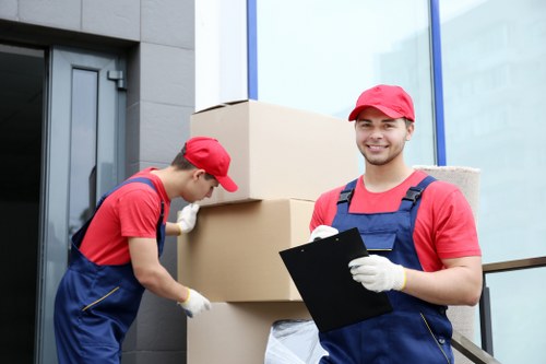 Professional house removalists assisting with packing