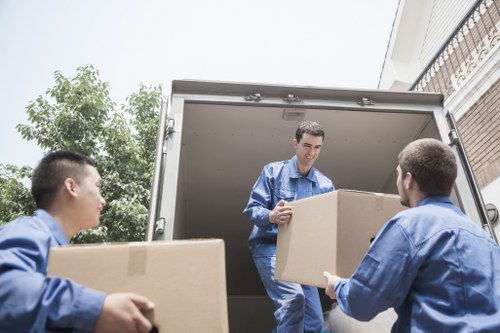 Truck drivers preparing a removal van for a move in Berowra