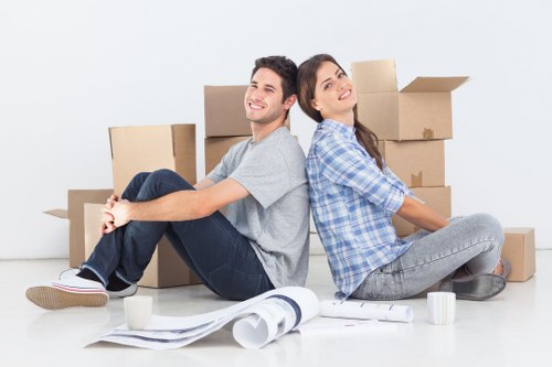 Professional movers loading a van