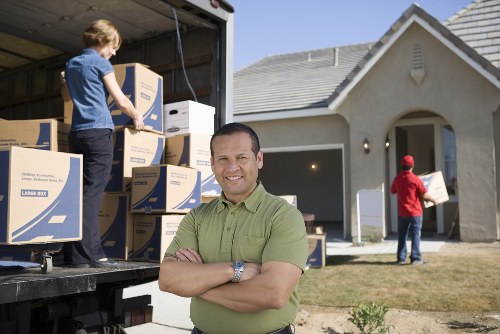 Professionals packing items for a move with Josh Removal