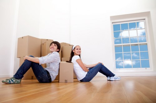 Professional movers handling furniture