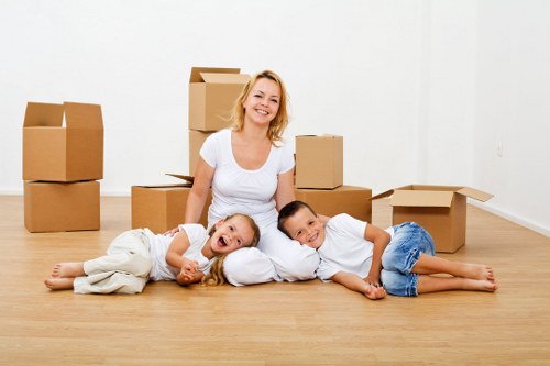 Professional movers loading items into a removal van