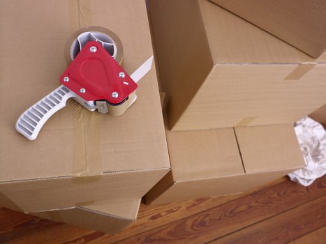 Team packing items carefully into a removal van