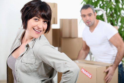 Professional movers loading a removal van