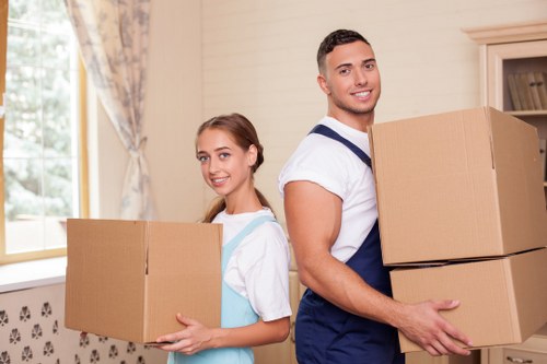 Professional movers handling furniture with care