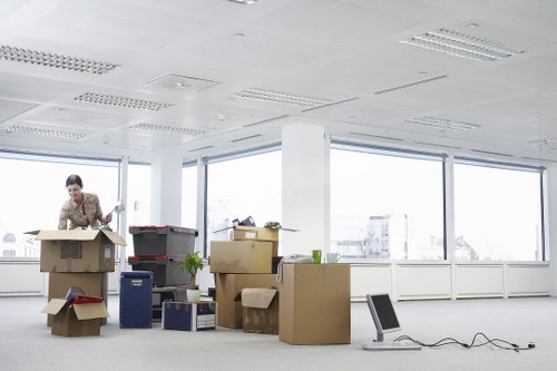 Professional movers loading items into a removal van