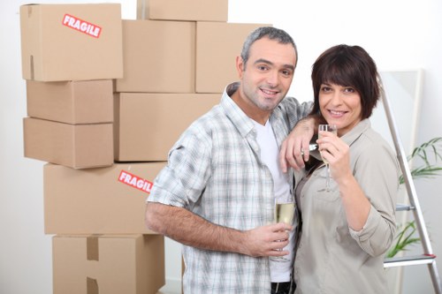 Professional movers loading items into a removal van